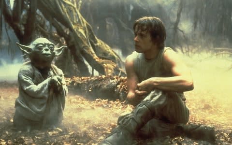 Mark Hamill as Luke Skywalker with his Jedi master Yoda in Star Wars: Empire Strikes Back - Credit:  Film Stills