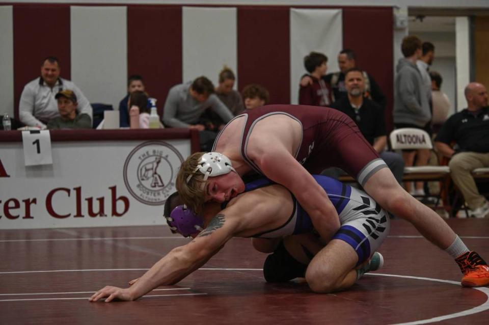 State College’s Asher Cunningham controls Mifflin County’s Deakon Schaeffer in their 160-pound PIAA Class 3A Northwest Regional final match on Saturday, Feb. 24, 2024 at Altoona. Cunningham beat Schaeffer, 27-11, in 4:41.