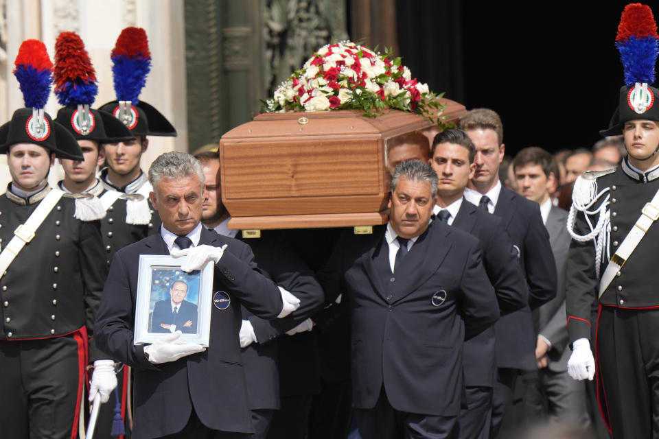 The coffin of media mogul and former Italian Premier Silvio Berlusconi leaves the Milan's Gothic Cathedral at the end his state funeral in northern Italy, Wednesday, June 14, 2023. Berlusconi died at the age of 86 on Monday in a Milan hospital where he was being treated for chronic leukemia. (AP Photo/Luca Bruno)