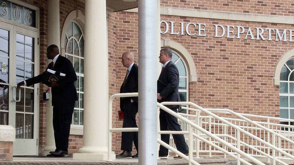 Anthony Carrington, chief of detectives for the Ocean County Prosecutor's Office, with his colleagues Lts. Thomas Tiernan and Brian Haggerty, enter Lavallette Police Headquarters on May 19, 2022 to take over command of the municipal force.