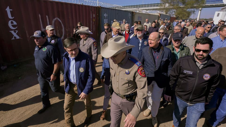 House Speaker Mike Johnson, center left, and Texas Department of Public Safety chief Steve McCraw, center right, lead a group of Republican members of Congress during a tour of the Texas-Mexico border. - Eric Gay/AP