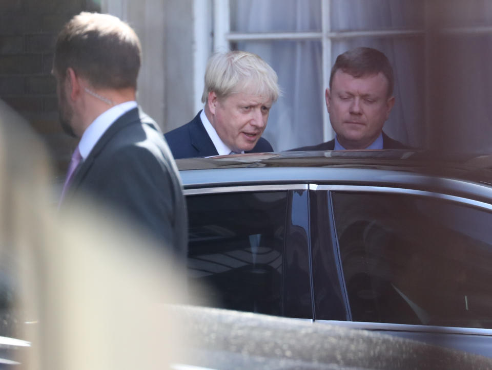 Boris Johnson leaves Whitehall before a meeting with Queen Elizabeth II where he will accept her invitation to become Prime Minister and form a new government.