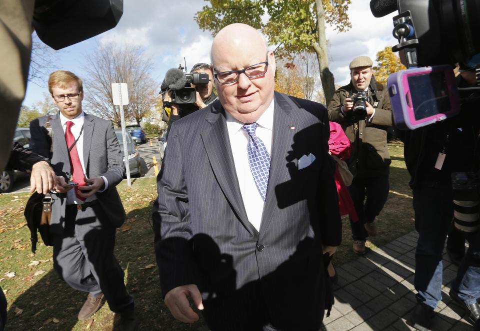 Prince Edward Island Senator Mike Duffy arrives on Parliament Hill in Ottawa October 22, 2013. The Senate is debating whether to suspend Senators Duffy, Pamela Wallin and Patrick Brazeau without pay. REUTERS/Chris Wattie (CANADA - Tags: POLITICS)