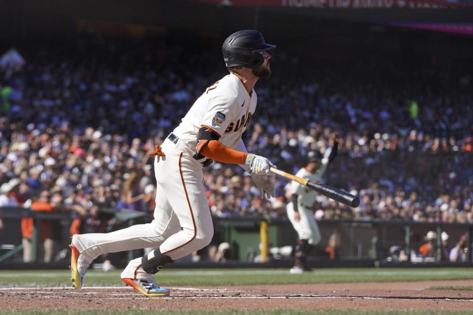 The Giants' Luis González watches his RBI single against the Dodgers during the second inning June 11, 2022.