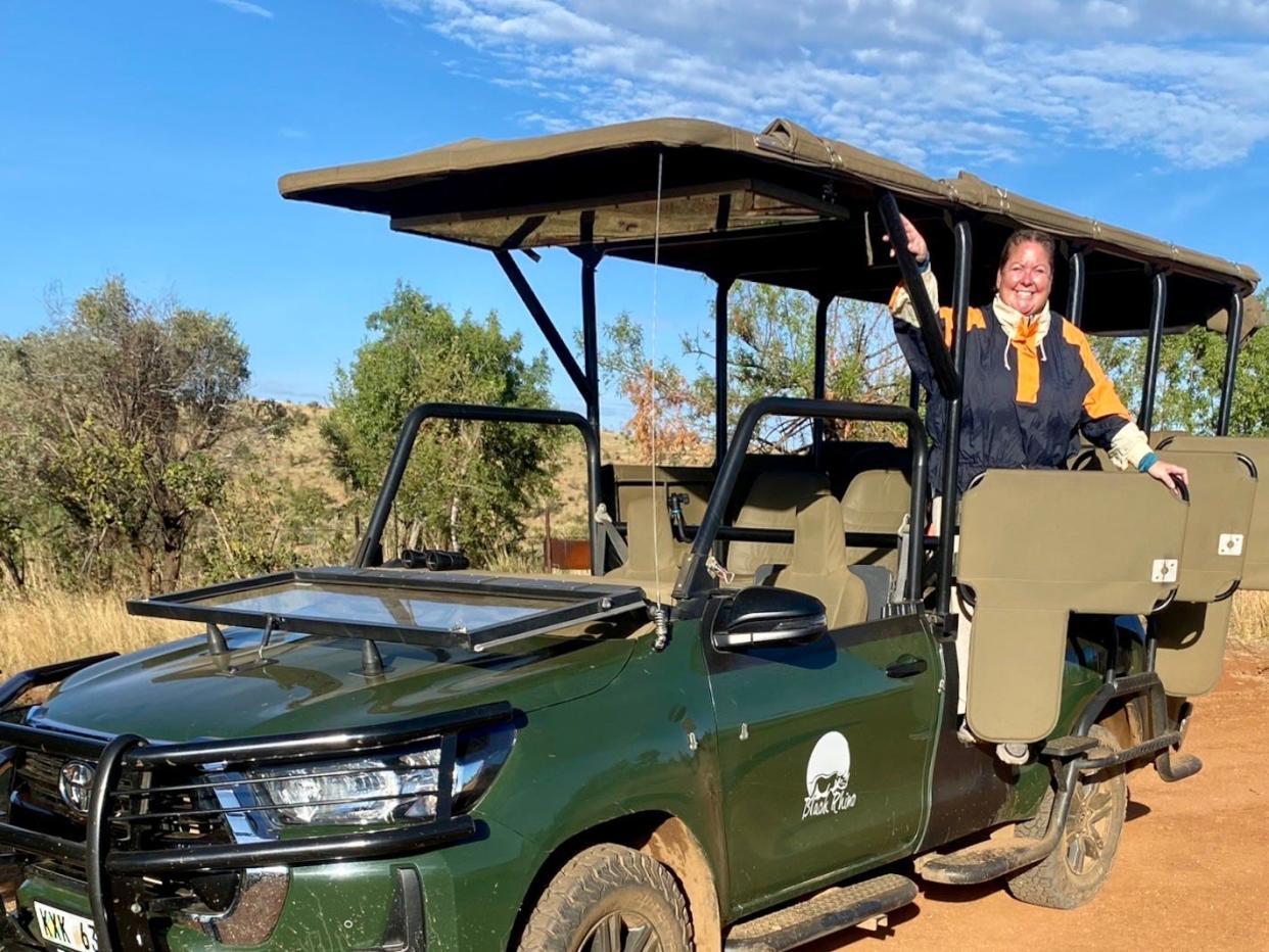 The author posing on a safari jeep.