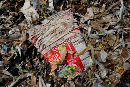 The Wider Image: Cash for trash: Indonesia village banks on waste recycling