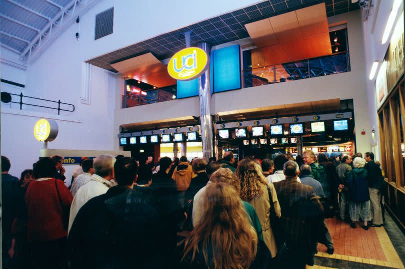 People queue outside a cinema