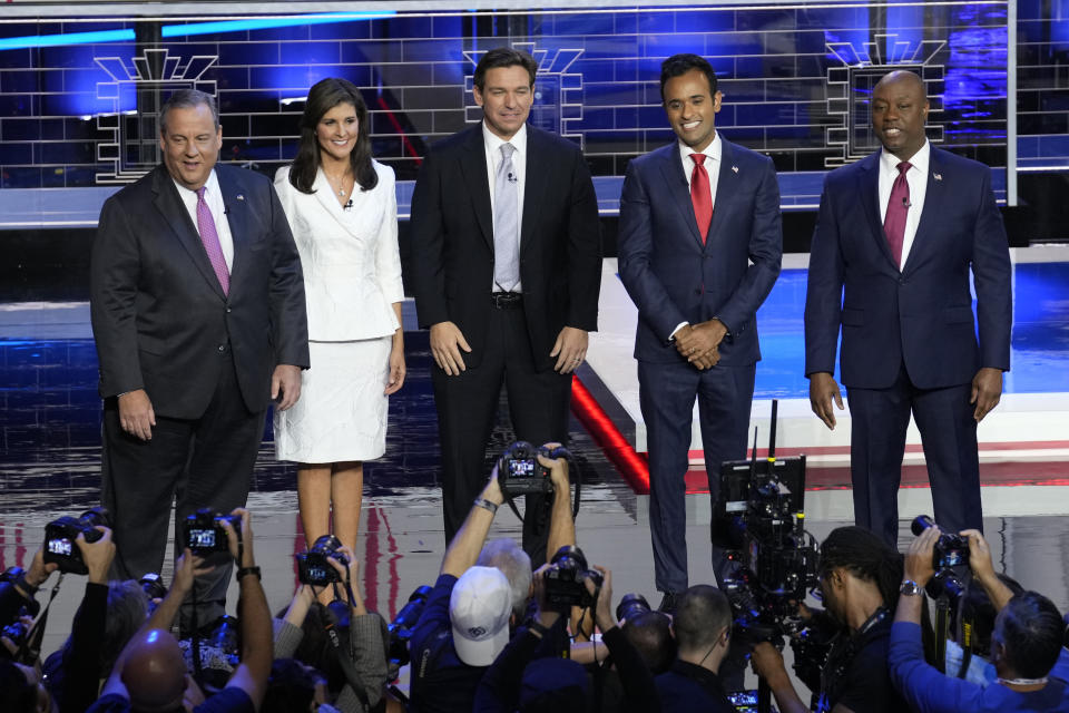 Former New Jersey Gov. Chris Christie, former UN Ambassador Nikki Haley, Florida Gov. Ron DeSantis, businessman Vivek Ramaswamy and Sen. Tim Scott, R-S.C., stand on stage before a Republican presidential primary debate hosted by NBC News, Wednesday, Nov. 8, 2023, at the Adrienne Arsht Center for the Performing Arts of Miami-Dade County in Miami. (AP Photo/Rebecca Blackwell)