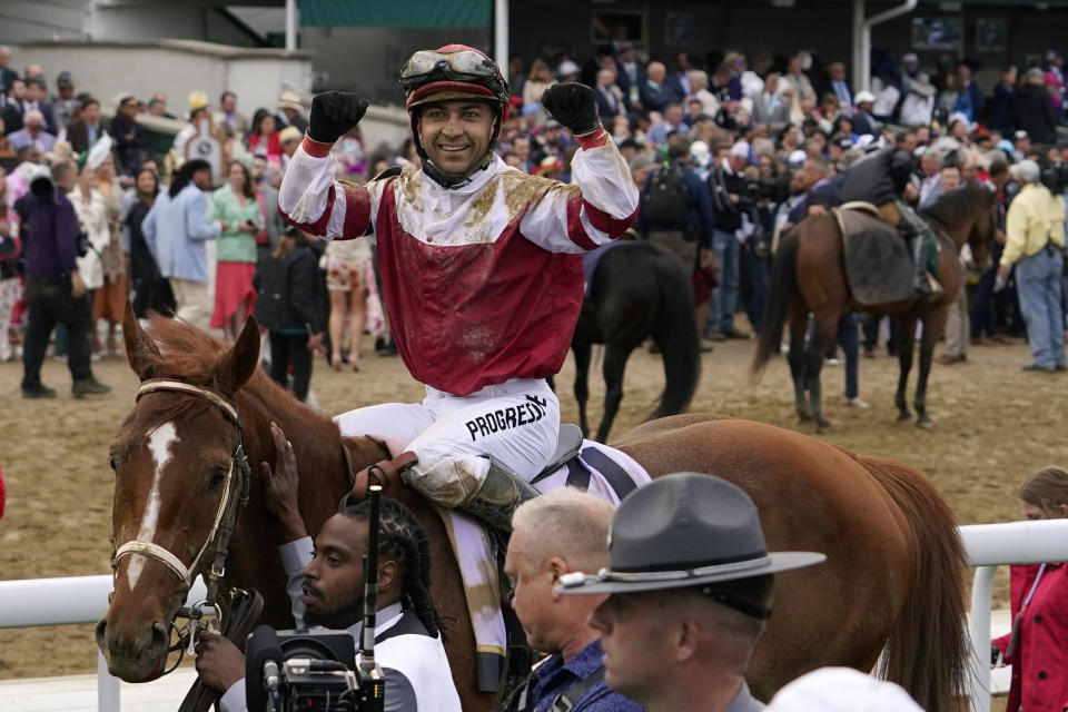 Sonny Leon rides Rich Strike to the winner's circle after the 148th running of the Kentucky Derby horse race at Churchill Downs Saturday, May 7, 2022, in Louisville, Ky. (AP Photo/Brynn Anderson)