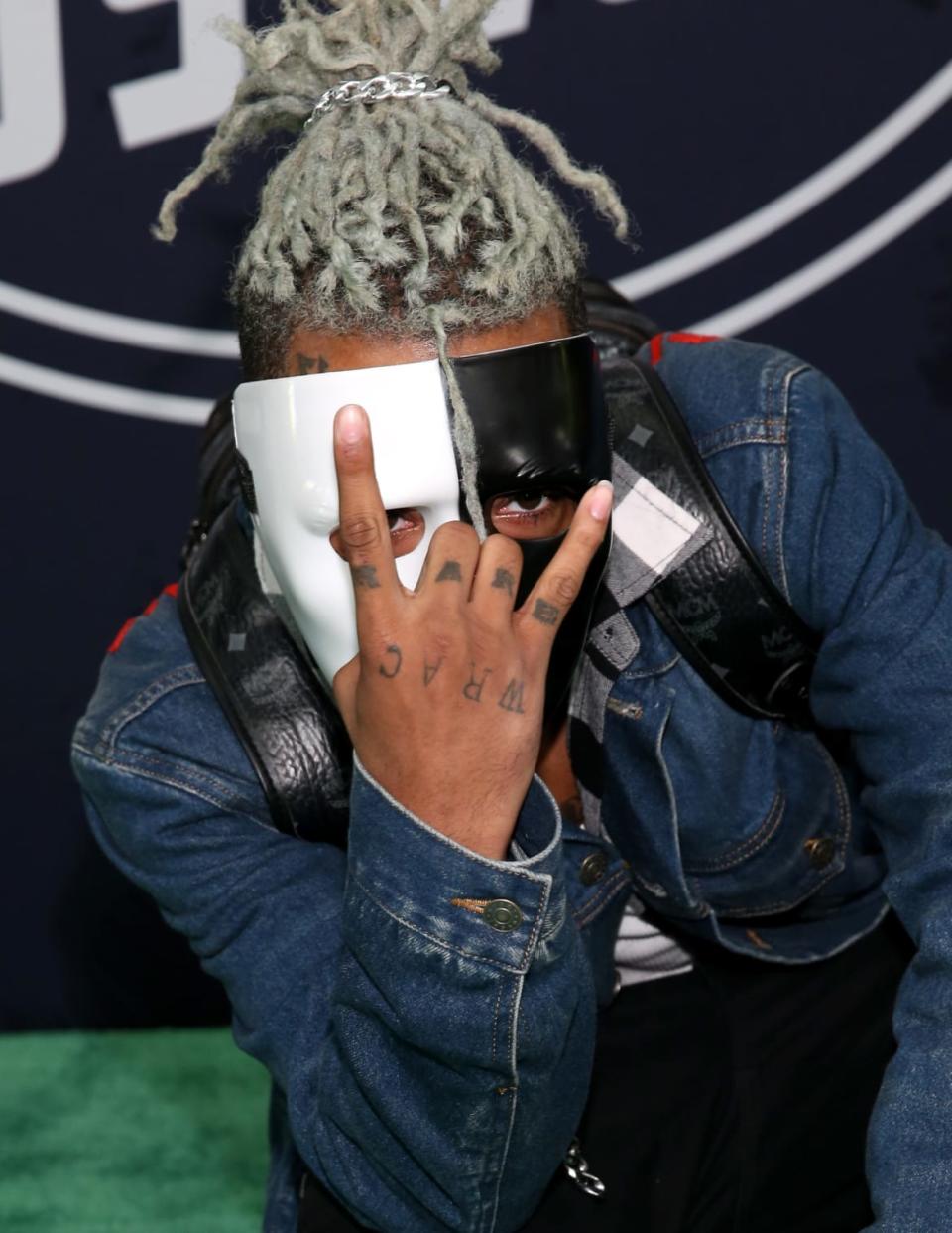 <div class="inline-image__caption"><p>Rapper XXXTentacion attends the BET Hip Hop Awards 2017 at The Fillmore Miami Beach on Oct. 6, 2017, in Miami Beach, Florida.</p></div> <div class="inline-image__credit">Bennett Raglin/Getty</div>