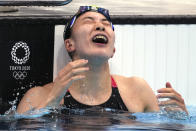 Yui Ohashi of Japan celebrates winning the women's 200-meter individual medley final at the 2020 Summer Olympics, Wednesday, July 28, 2021, in Tokyo, Japan. (AP Photo/Matthias Schrader)