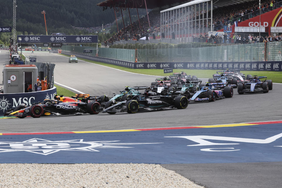 Red Bull driver Max Verstappen of the Netherlands, left, steers his car during the Formula One Grand Prix at the Spa-Francorchamps racetrack in Spa, Belgium, Sunday, July 30, 2023. (AP Photo/Geert Vanden Wijngaert)