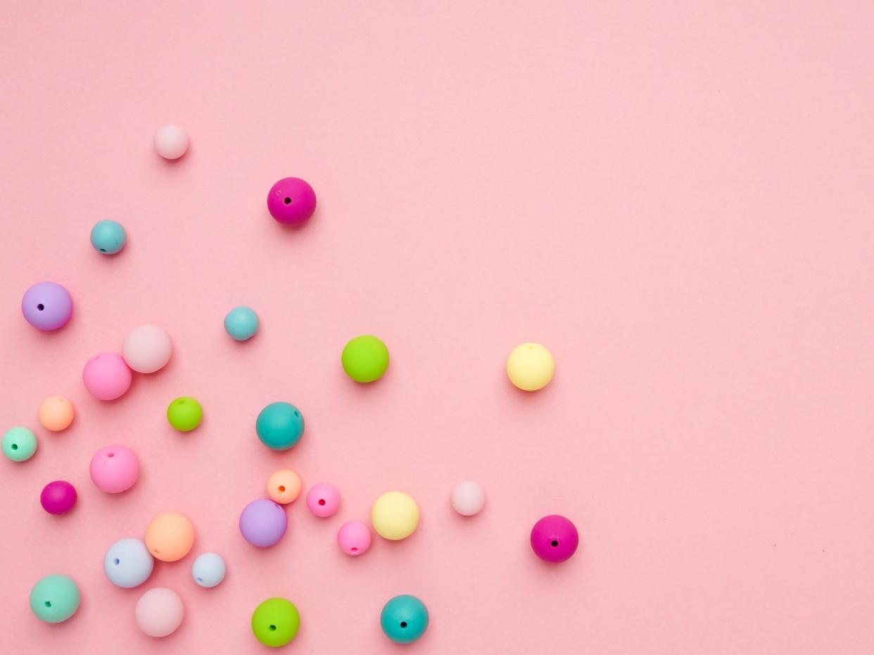 beads on pink minimalist background