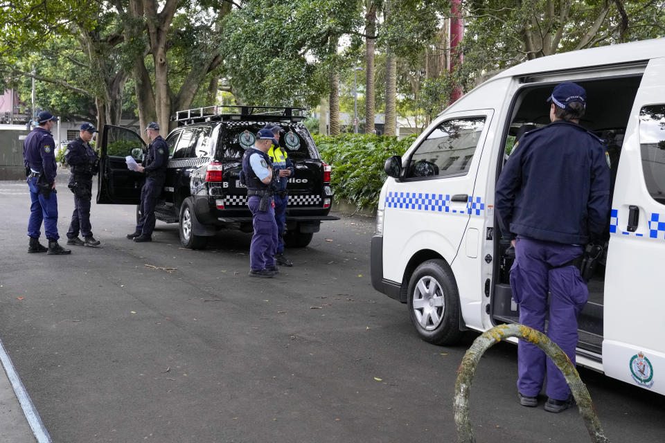 Police patrol a park where Blockade Australia protest organizer Sally-Anne Brown held a press conference in Sydney, Australia, Monday, June 27, 2022. News of Australia’s increasing greenhouse gas emissions comes as climate activist group Blockade Australia kicked off a weeklong campaign of disruption in Sydney by shutting down the downtown Sydney Harbor Tunnel during Monday morning’s peak traffic period. (AP Photo/Mark Baker)