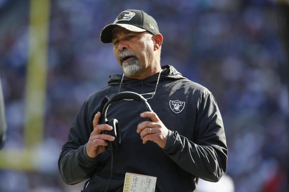 Las Vegas Raiders head coach Rich Bisiaccia talks to an official during the first half of an NFL football game against the New York Giants, Sunday, Nov. 7, 2021, in East Rutherford, N.J. (AP Photo/John Munson)