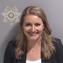 This booking photo provided by the Fulton County Sheriff's Office shows Jenna Ellis on Wednesday, Aug. 23, 2023, in Atlanta, after she surrendered and was booked. Ellis is charged alongside former President Donald Trump and 17 others, who are accused by Fulton County District Attorney Fani Willis of scheming to subvert the will of Georgia voters to keep the Republican president in the White House after he lost to Democrat Joe Biden. (Fulton County Sheriff's Office via AP)