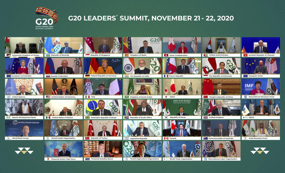 This handout photo provided by G20 Riyadh Summit, shows Saudi King Salman, center, and the rest of world leaders during a virtual G20 summit hosted by Saudi Arabia and held over video conference amid the Covid-19 pandemic, in Riyadh, Saudi Arabia, Saturday, Nov. 21, 2020. (G20 Riyadh Summit via AP)