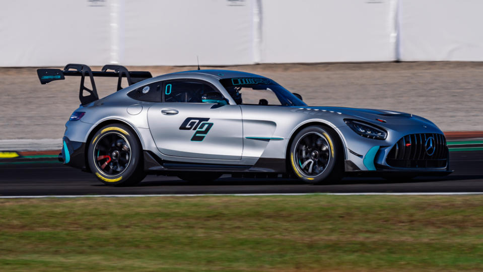 Driving the Mercedes-AMG GT2 race car on track.