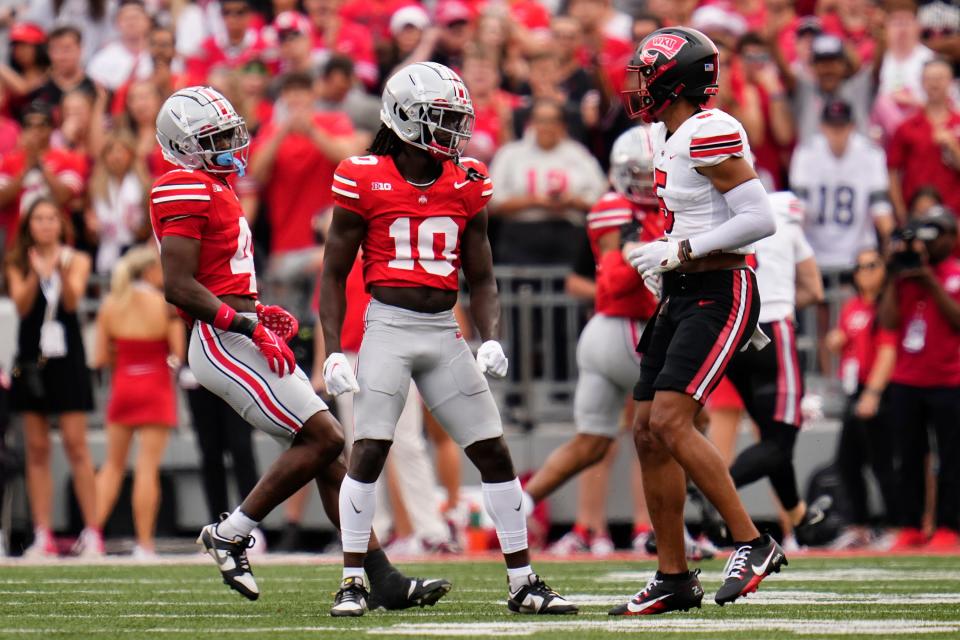 Sep 16, 2023; Columbus, Ohio, USA; Ohio State Buckeyes cornerback Denzel Burke (10) stares down Western Kentucky Hilltoppers wide receiver Blue Smith (5) after making a defensive stop during the NCAA football game at Ohio Stadium. Ohio State won 63-10.