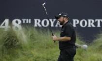 Ireland's Shane Lowry acknowledges the crowd after the competed his second round on the 18th green in British Open Golf Championships at Royal Portrush in Northern Ireland, Friday, July 19, 2019.(AP Photo/Matt Dunham)