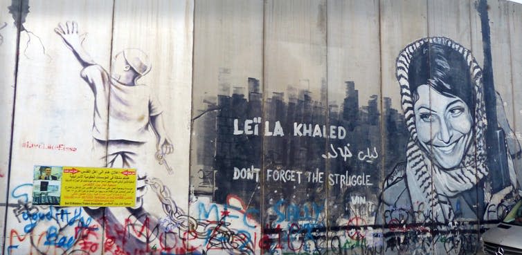 <span class="caption">Mural of Leila Khaled on a wall in Bethlehem.</span> <span class="attribution"><a class="link " href="https://commons.wikimedia.org/wiki/File:Leila_Khaled_-_Icon_of_the_Palestinian_Revolution.jpg" rel="nofollow noopener" target="_blank" data-ylk="slk:Rehgina/Wikimedia Commons;elm:context_link;itc:0;sec:content-canvas">Rehgina/Wikimedia Commons</a>, <a class="link " href="http://creativecommons.org/licenses/by-sa/4.0/" rel="nofollow noopener" target="_blank" data-ylk="slk:CC BY-SA;elm:context_link;itc:0;sec:content-canvas">CC BY-SA</a></span>