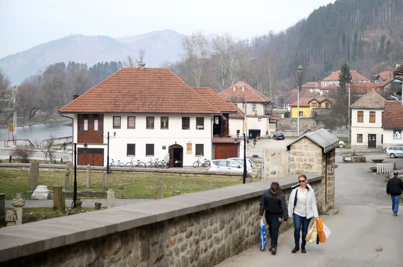 People walk in an old area of Maglaj, Bosnia and Herzegovina