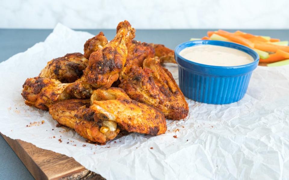 <p>Alison Ashton</p><p>Lemon pepper, brown sugar, chili powder and more come together in a fantastic dry rub for these tasty wings.</p><p><strong>Get the recipe: <a href="https://parade.com/965344/parade/these-last-minute-dixie-chicken-wings-are-easy-and-delicious/" rel="nofollow noopener" target="_blank" data-ylk="slk:Dixie Chicken Wings;elm:context_link;itc:0;sec:content-canvas" class="link ">Dixie Chicken Wings</a></strong></p>