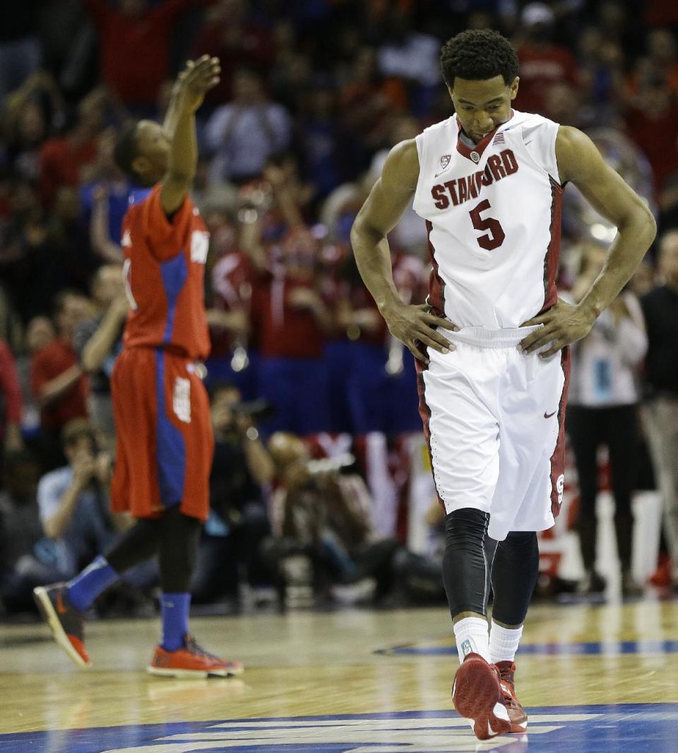 Stanford guard Chasson Randle (5) walks off the court after the second half in a regional semifinal game against Dayton at the NCAA college basketball tournament, Thursday, March 27, 2014, in Memphis, Tenn. Dayton won 82-72. (AP Photo/Mark Humphrey)