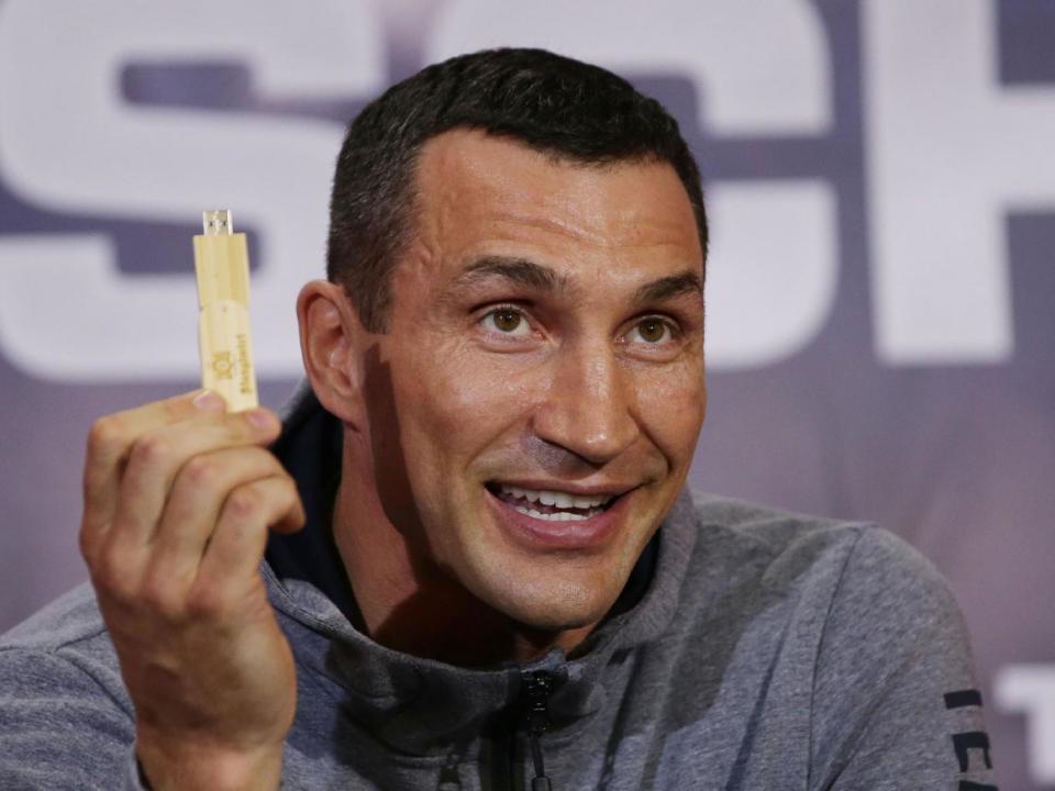 Wladimir Klitschko brandishes a USB drive with his fight prediction (Getty)