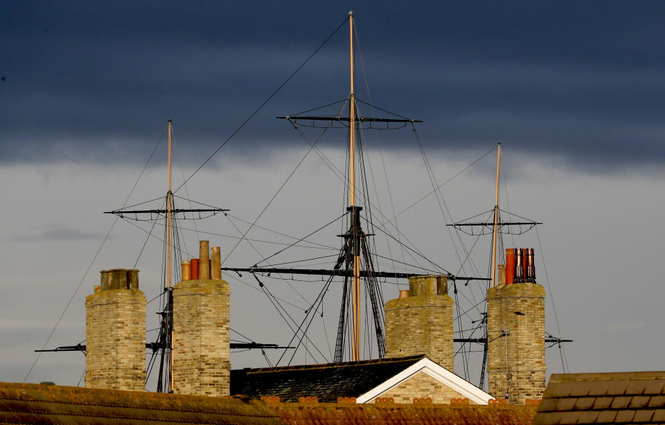 The mast of HMS Trincomalee, the oldest warship still afloat in Europe, rises above the rooftops in Hartlepool, England, Tuesday, Nov. 12, 2019. Hartlepool, a former shipbuilding center 250 miles (400 kms) north of London where unemployment is more than double the national average, is a town full of leavers. (AP Photo/Frank Augstein)