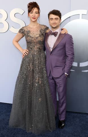 <p>Dia Dipasupil/Getty</p> Erin Darke and Daniel Radcliffe attend the 77th Annual Tony Awards in New York City.