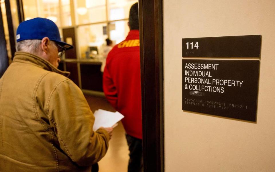 People wait to work with staff at the Jackson County Assessment office on Friday, March 29, 2024, in Independence, Missouri. Nick Wagner/nwagner@kcstar.com