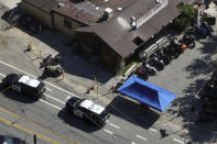 This aerial photo shows Cook's Corner Thursday, Aug. 24, 2023, in Trabuco Canyon, Calif. Gunfire at the popular Southern California biker bar killed three people and wounded five others, and the gunman — believed to be a retired law enforcement officer — was fatally shot by deputies, authorities said. (AP Photo/Jae C. Hong)