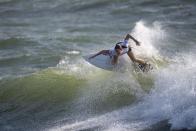 <p>South Africa's Bianca Buitendag rides a wave during the women's Surfing Third round at the Tsurigasaki Surfing Beach, in Chiba, on July 26, 2021 during the Tokyo 2020 Olympic Games. (Photo by Olivier MORIN / AFP)</p> 