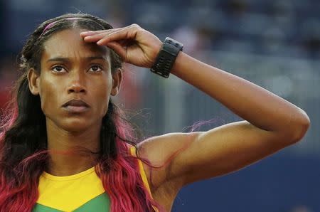 Stephanie Mcpherson of Jamaica gestures from the starting block on her way to winning the Women's 400m final at the Commonwealth Games in Glasgow, Scotland, July 29, 2014. REUTERS/Suzanne Plunkett