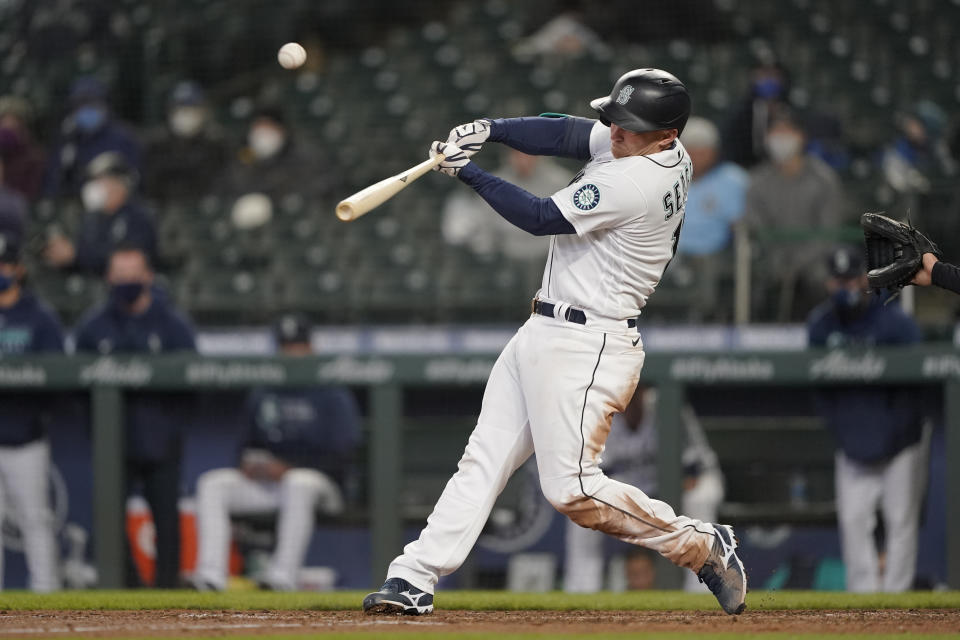 Seattle Mariners' Kyle Seager hits a three-run double during the sixth inning of the team's baseball game against the Chicago White Sox, Wednesday, April 7, 2021, in Seattle. (AP Photo/Ted S. Warren)