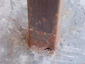 Rusted steel support beam.