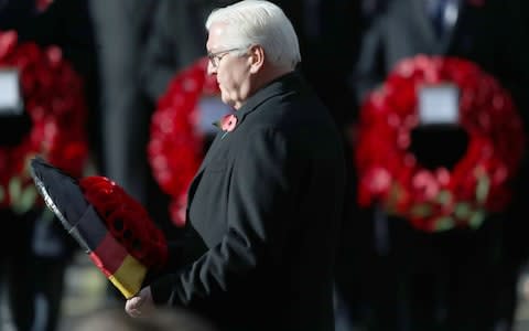 President of Germany Frank-Walter Steinmeier lays a wreath during the remembrance service at the Cenotaph memorial - Credit: PA