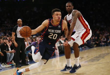 Mar 30, 2019; New York, NY, USA; New York Knicks forward Kevin Knox (20) drives to the basket against Miami Heat guard Dion Waiters (11) during the second half at Madison Square Garden. Mandatory Credit: Noah K. Murray-USA TODAY Sports