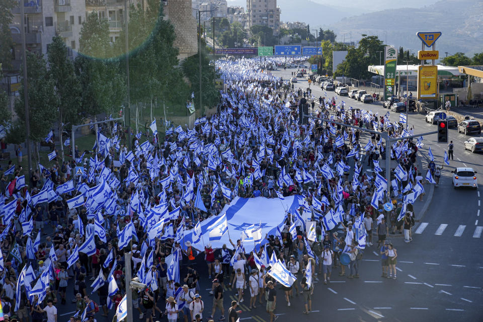 Thousands of Israelis march to Jerusalem in protest of plans by Prime Minister Benjamin Netanyahu's government to overhaul the judicial system, in Jerusalem, Saturday, July 22, 2023. Thousands of demonstrators entered the last leg of a four-day and nearly 70-kilometer (roughly 45-mile) trek from Tel Aviv to Jerusalem. Protest organizers planned to camp overnight outside Israel's parliament on Saturday. (AP Photo/Ohad Zwigenberg)