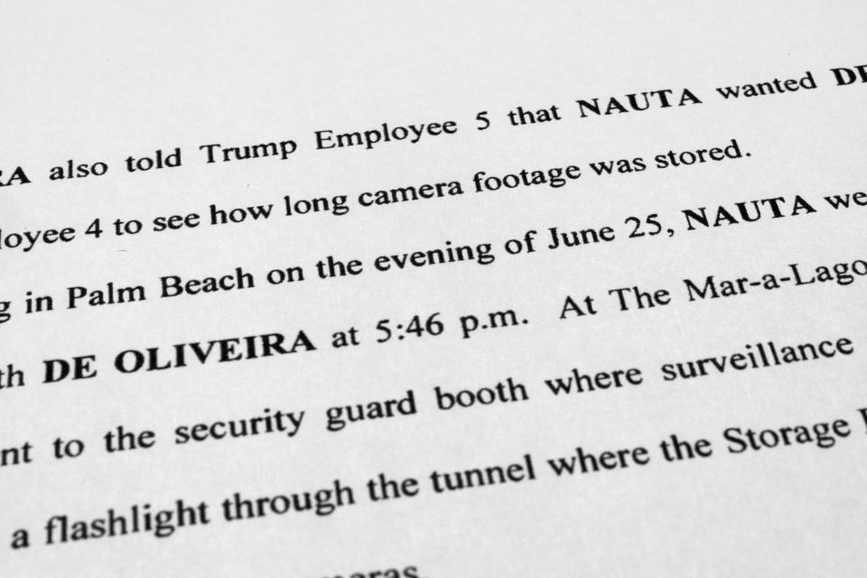 The updated indictment against former President Donald Trump, Walt Nauta and Carlos De Oliveira is photographed Friday, July 28, 2023. New allegations in the classified documents case against Trump deepen his legal jeopardy as he braces for possible additional indictments related to efforts to overturn the 2020 election. (AP Photo/Jon Elswick)