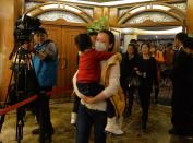 Chinese relatives of passengers from the missing Malaysia Airlines flight MH370 leave a meetining with officials at the Metro Park Lido Hotel in Beijing on March 16, 2014