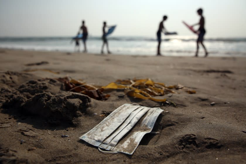 LOS ANGELES, CA - OCTOBER 09: A discarded face covering is seen on the beach in Santa Monica on Friday, Oct. 9, 2020 in Los Angeles, CA. Masks and gloves have made the top ten list for trash found on area beaches. The discovery was made during this year's annual coastal cleanup done by thousands of volunteers. (Dania Maxwell / Los Angeles Times)