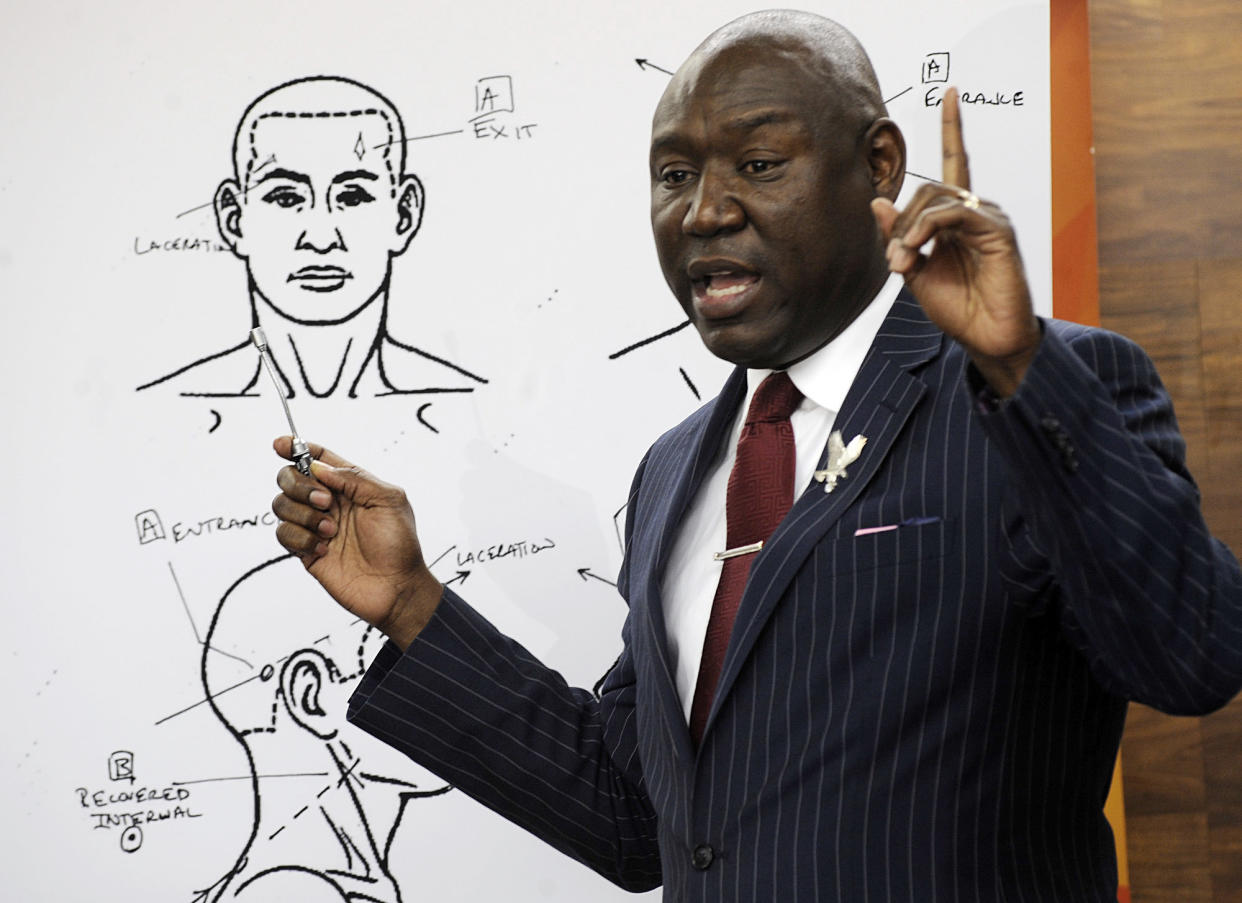 FILE - In this Monday, Dec. 3, 2018 file photo, attorney Ben Crump holds a news conference in Birmingham, Ala., to discuss the results of a forensic examination on Emantic "EJ" Bradford Jr., who was fatally shot by police in a shopping mall on Thanksgiving day. Crump, who represents Bradford's family, says a report shows the 21-year-old black man suffered three gunshot wounds to the back side of his body. (AP Photo/Jay Reeves)