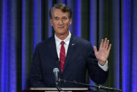 Republican gubernatorial candidate Glenn Youngkin, waves to supporters at the start of a debate at the Appalachian School of Law in Grundy, Va., Thursday, Sept. 16, 2021. (AP Photo/Steve Helber)