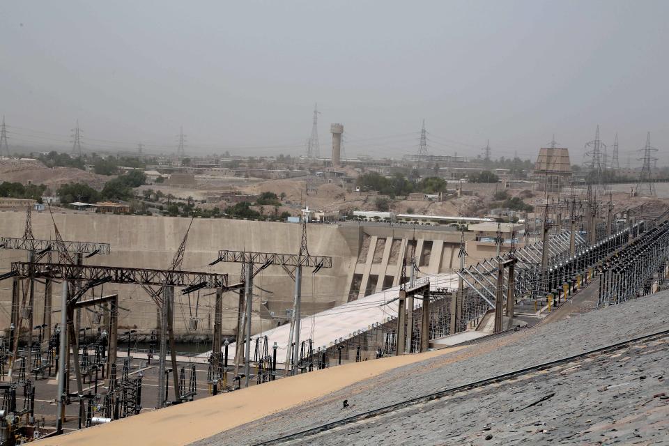 FILE - this May 7 , 2018 file photo, shows the high dam in Aswan, Egypt. Egyptians are marking 50 years since the inauguration of the Nile dam, a massive feat of construction that has shaped the course of modern-day Egypt. It spared it from seasonal droughts and flooding, and generated electricity, but it also displaced members of the country's Nubian minority and had a lasting environmental impact on the region. (AP Photo/Nariman El-Mofty, File)