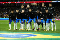 The Brazil team players pose for a photo before the start of a friendly soccer match between Spain and Brazil at the Santiago Bernabeu stadium in Madrid, Spain, Tuesday, March 26, 2024. (AP Photo/Jose Breton)