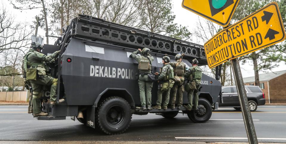 DeKalb, Ga., and Atlanta SWAT members are pictured leaving the Gresham Park command post in Atlanta on Wednesday, Jan. 18, 2023.