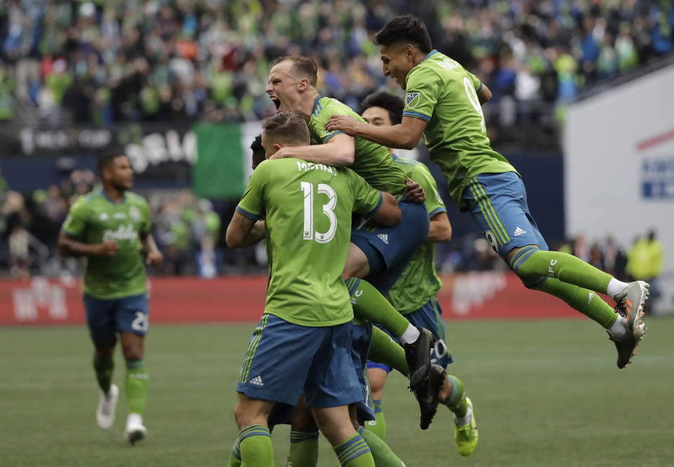 Seattle Sounders celebrate after Kelvin Leerdam scored against the Toronto FC, Sunday, Nov. 10, 2019, during the second half of the MLS Cup championship soccer match in Seattle. (AP Photo/Ted S. Warren)