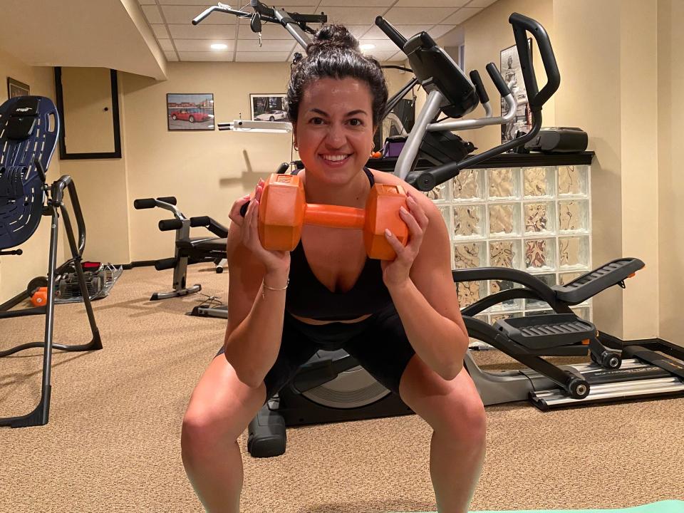 Fabiana works her upper body with three sets of 12 bicep curls.